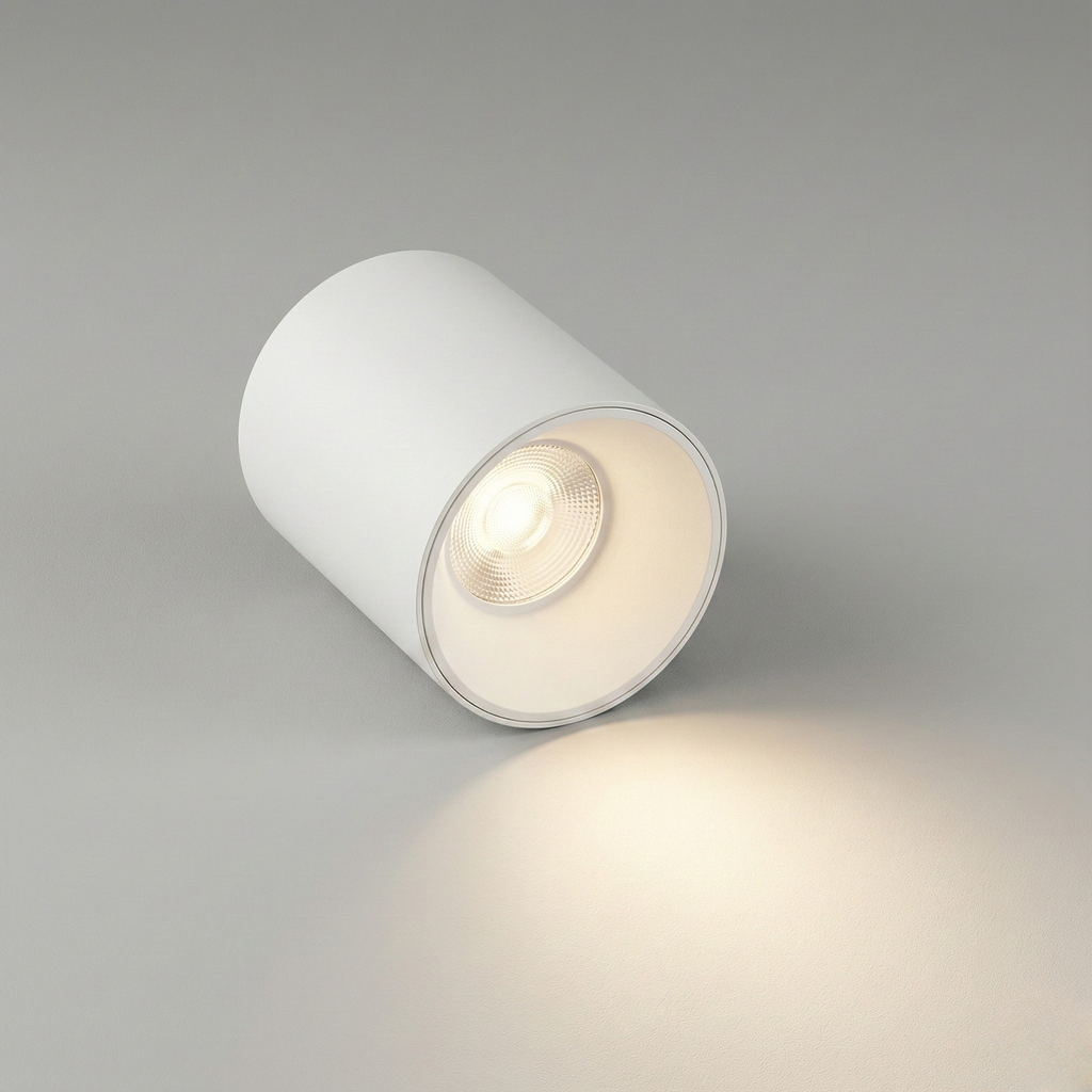 White cylindrical ceiling light fixture on a gray background
